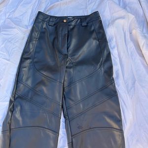 Faux leather pants in black